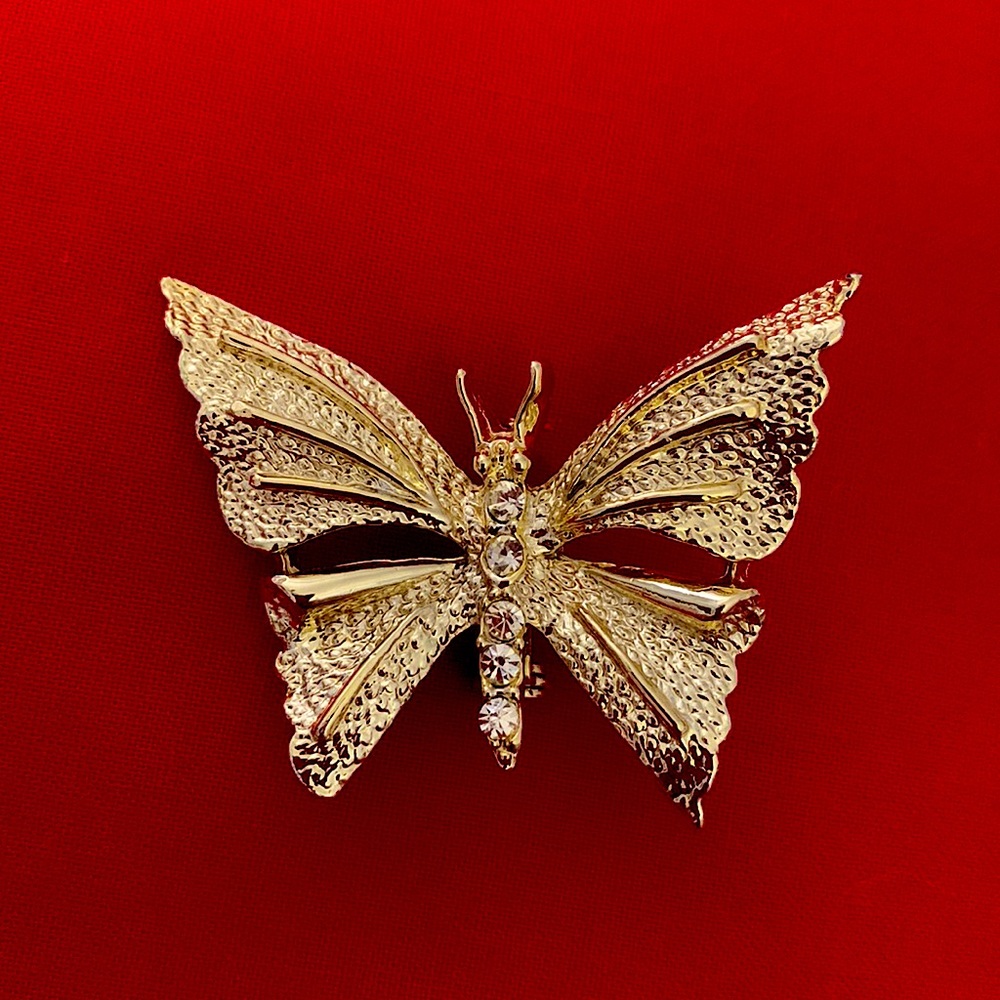 Vintage Gerry’s goldtone brooch with rhinestones. In excellent condition.
